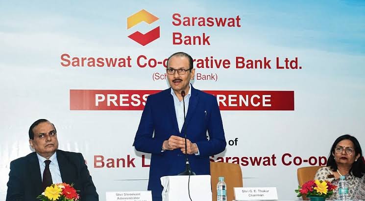 saraswat-co-op-bank-unveils-merger-plan-with-new-india-new-india-cooperative-bank-set-to-merge-with-saraswat-bank-202507.jpeg | न्यू इंडिया को—ऑपरेटिव्ह बँकेचं विलीनीकरण | belgaum news | belgavkar बेळगावकर
